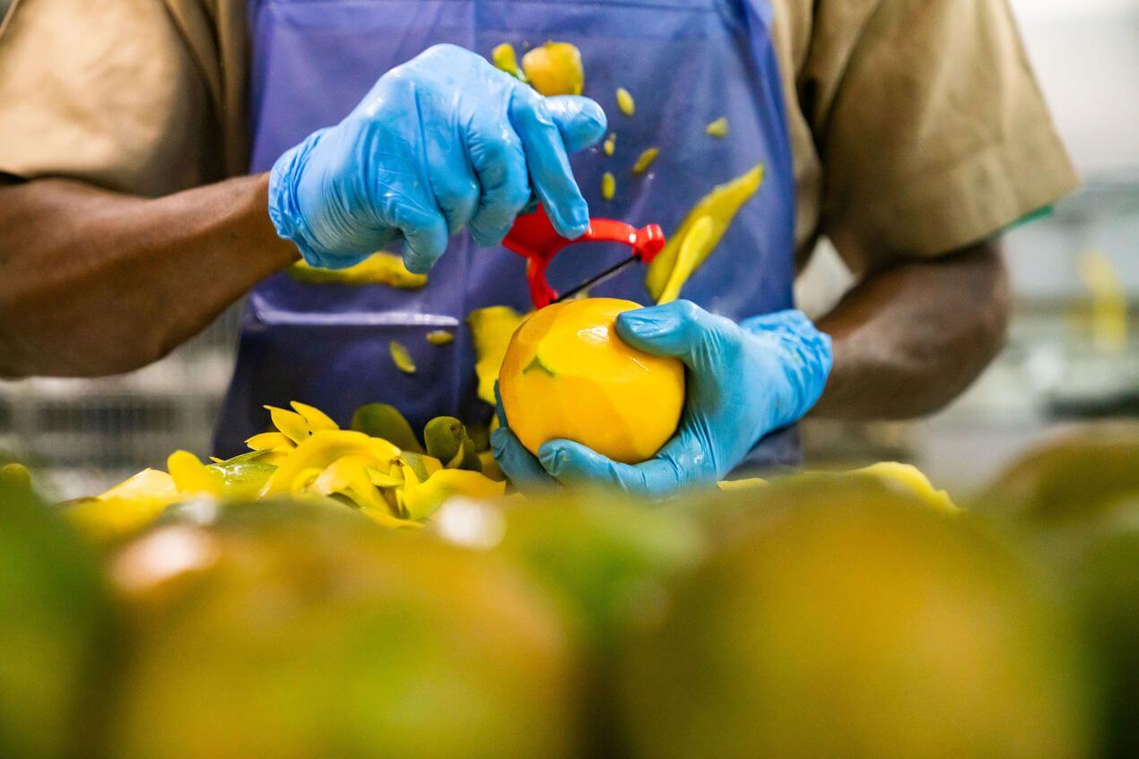 Wallaroo organic mango being peeled